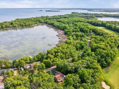 Nestled on a tranquil dead-end road, this stunning four-bedroom on Deacons Lodge Golf Course in Minnesota - for sale on GolfHomes.com, golf home, golf lot