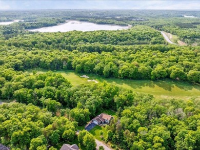 Nestled on a tranquil dead-end road, this stunning four-bedroom on Deacons Lodge Golf Course in Minnesota - for sale on GolfHomes.com, golf home, golf lot