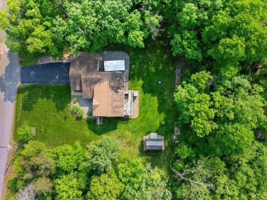 Nestled on a tranquil dead-end road, this stunning four-bedroom on Deacons Lodge Golf Course in Minnesota - for sale on GolfHomes.com, golf home, golf lot
