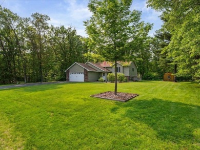 Nestled on a tranquil dead-end road, this stunning four-bedroom on Deacons Lodge Golf Course in Minnesota - for sale on GolfHomes.com, golf home, golf lot