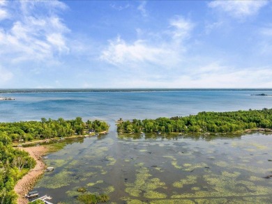 Nestled on a tranquil dead-end road, this stunning four-bedroom on Deacons Lodge Golf Course in Minnesota - for sale on GolfHomes.com, golf home, golf lot