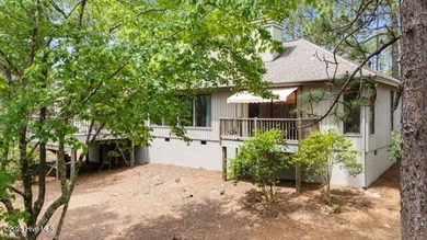 Welcome to this beautifully updated single-level home, perfectly on Pinewild Country Club of Pinehurst in North Carolina - for sale on GolfHomes.com, golf home, golf lot