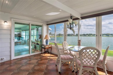 This stunning lakefront retreat in the sought-after 55+ on Imperial Lakewoods Golf Club in Florida - for sale on GolfHomes.com, golf home, golf lot