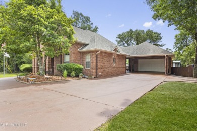 Welcome to this stunning custom-built 4-bedroom, 2.5-bath home on Diamondhead Country Club in Mississippi - for sale on GolfHomes.com, golf home, golf lot