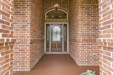 Welcome to this stunning custom-built 4-bedroom, 2.5-bath home on Diamondhead Country Club in Mississippi - for sale on GolfHomes.com, golf home, golf lot