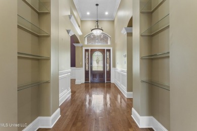 Welcome to this stunning custom-built 4-bedroom, 2.5-bath home on Diamondhead Country Club in Mississippi - for sale on GolfHomes.com, golf home, golf lot
