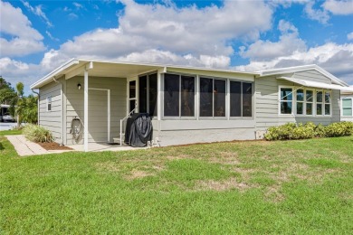 This stunning lakefront retreat in the sought-after 55+ on Imperial Lakewoods Golf Club in Florida - for sale on GolfHomes.com, golf home, golf lot