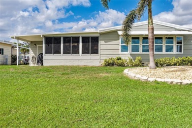 This stunning lakefront retreat in the sought-after 55+ on Imperial Lakewoods Golf Club in Florida - for sale on GolfHomes.com, golf home, golf lot