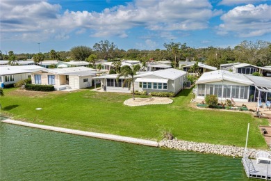 This stunning lakefront retreat in the sought-after 55+ on Imperial Lakewoods Golf Club in Florida - for sale on GolfHomes.com, golf home, golf lot