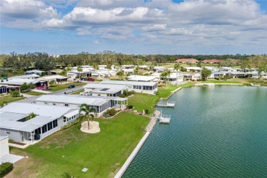 This stunning lakefront retreat in the sought-after 55+ on Imperial Lakewoods Golf Club in Florida - for sale on GolfHomes.com, golf home, golf lot