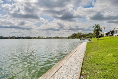 This stunning lakefront retreat in the sought-after 55+ on Imperial Lakewoods Golf Club in Florida - for sale on GolfHomes.com, golf home, golf lot