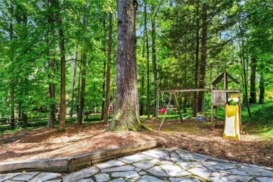 Nestled in the heart of Alpharetta this renovated home in on The Golf Club of Georgia in Georgia - for sale on GolfHomes.com, golf home, golf lot