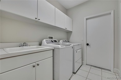 Beautifully upgraded home with 4 bedrooms, 2.5 baths and a 3 car on Southern Woods Golf Club in Florida - for sale on GolfHomes.com, golf home, golf lot