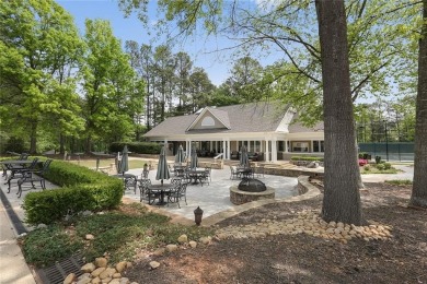 Nestled in the heart of Alpharetta this renovated home in on The Golf Club of Georgia in Georgia - for sale on GolfHomes.com, golf home, golf lot