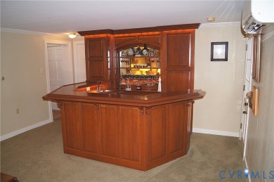 Tucked in a friendly, private neighborhood, this beautifully on Hanover Country Club in Virginia - for sale on GolfHomes.com, golf home, golf lot