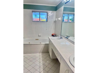 Discover this rare 3-bed, 2.5-bath townhome in a fenced, 52-home on Jim McLean Signature Course in Florida - for sale on GolfHomes.com, golf home, golf lot