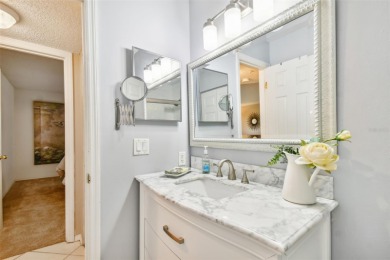 Just Listed!  **This is a second floor elevator accessible on Feather Sound Country Club in Florida - for sale on GolfHomes.com, golf home, golf lot
