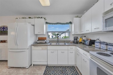 SENSATIONAL Sheffield model with EXTENDED LANAI that is enclosed on Kings Gate Golf Club in Florida - for sale on GolfHomes.com, golf home, golf lot