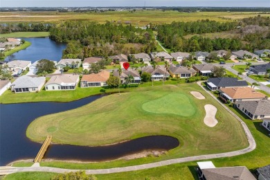 AN ELEGANT GRAND CYPRESS FLOOR PLAN ON THE 14TH GREEN OF THE on Tampa Bay Golf and Country Club in Florida - for sale on GolfHomes.com, golf home, golf lot