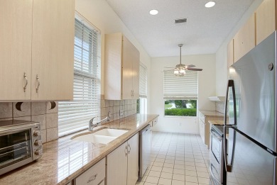 Relax looking out of this wide lake view in this freshly painted on St. Lucie Trail Golf Club in Florida - for sale on GolfHomes.com, golf home, golf lot