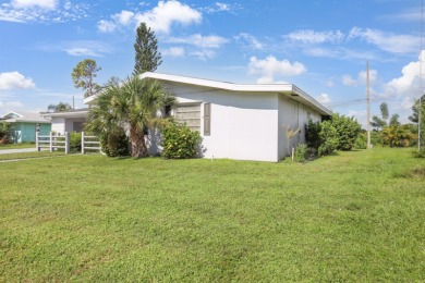 Welcome to this inviting 1963 two-bedroom, two-bathroom home on Port Charlotte Golf Club in Florida - for sale on GolfHomes.com, golf home, golf lot