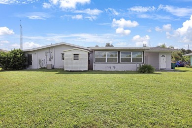 Welcome to this inviting 1963 two-bedroom, two-bathroom home on Port Charlotte Golf Club in Florida - for sale on GolfHomes.com, golf home, golf lot