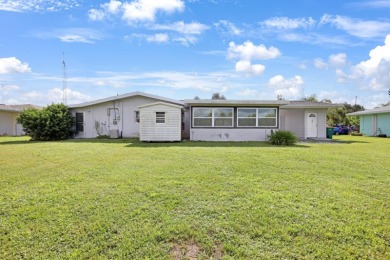 Welcome to this inviting 1963 two-bedroom, two-bathroom home on Port Charlotte Golf Club in Florida - for sale on GolfHomes.com, golf home, golf lot