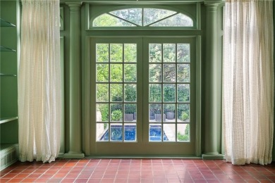 This stunning Mediterranean-style estate exudes timeless on Bobby Jones Golf Club in Georgia - for sale on GolfHomes.com, golf home, golf lot