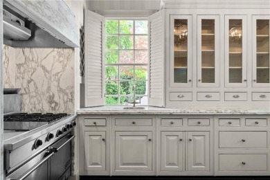 This stunning Mediterranean-style estate exudes timeless on Bobby Jones Golf Club in Georgia - for sale on GolfHomes.com, golf home, golf lot
