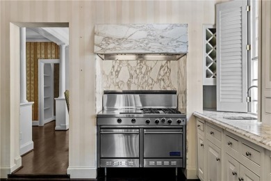This stunning Mediterranean-style estate exudes timeless on Bobby Jones Golf Club in Georgia - for sale on GolfHomes.com, golf home, golf lot