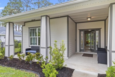 Discover this beautifully maintained 3-bedroom, 2-bathroom home on The Grand Club Cypress Course in Florida - for sale on GolfHomes.com, golf home, golf lot
