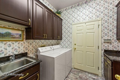Step into timeless elegance with this stunning former Parade on Sunbrook Golf Course in Utah - for sale on GolfHomes.com, golf home, golf lot