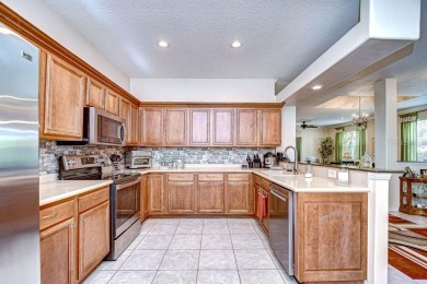 This BEAUTIFULLY MAINTAINED 3 bedroom courtyard home is move-in on The Groves Golf and Country Club in Florida - for sale on GolfHomes.com, golf home, golf lot