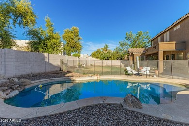 This beautifully maintained 5-bedroom, 3-bath home features a on Augusta Ranch Golf Club in Arizona - for sale on GolfHomes.com, golf home, golf lot