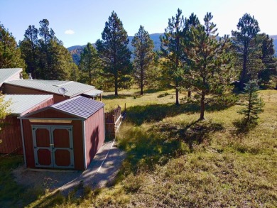 Charming mountain retreat located in the desirable Valle on El Valle Escondido Golf Course in New Mexico - for sale on GolfHomes.com, golf home, golf lot