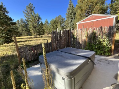 Charming mountain retreat located in the desirable Valle on El Valle Escondido Golf Course in New Mexico - for sale on GolfHomes.com, golf home, golf lot