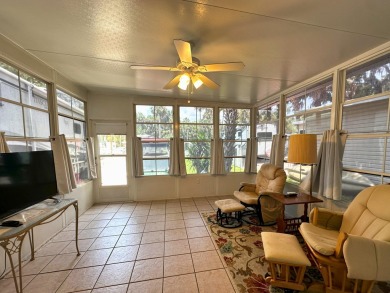 This Florida room located in The Great Outdoors Premier RV/Golf on The Great Outdoors Golf and Country Club in Florida - for sale on GolfHomes.com, golf home, golf lot