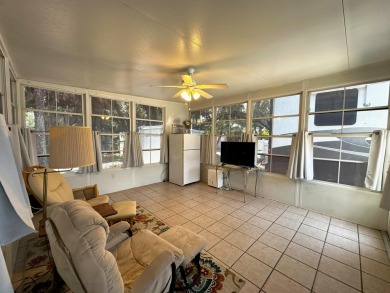 This Florida room located in The Great Outdoors Premier RV/Golf on The Great Outdoors Golf and Country Club in Florida - for sale on GolfHomes.com, golf home, golf lot