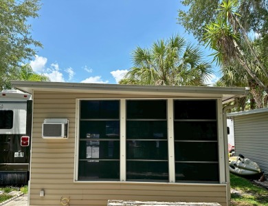 This Florida room located in The Great Outdoors Premier RV/Golf on The Great Outdoors Golf and Country Club in Florida - for sale on GolfHomes.com, golf home, golf lot