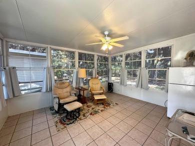 This Florida room located in The Great Outdoors Premier RV/Golf on The Great Outdoors Golf and Country Club in Florida - for sale on GolfHomes.com, golf home, golf lot