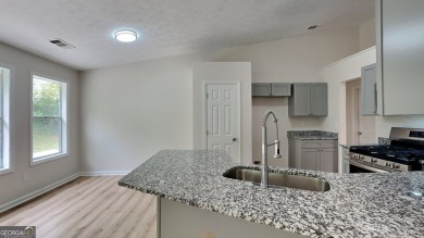 This renovated 3 bedroom, 2 bathroom home offers modern living on Mystery Valley Golf Course in Georgia - for sale on GolfHomes.com, golf home, golf lot