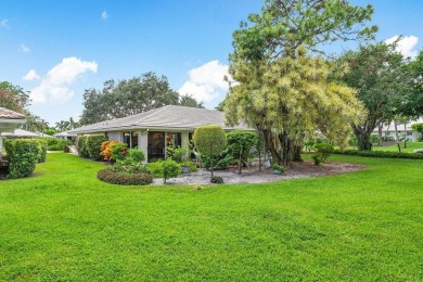 Welcome to your tranquil retreat featuring a captivating garden on Quail Ridge Golf Course and Country Club in Florida - for sale on GolfHomes.com, golf home, golf lot