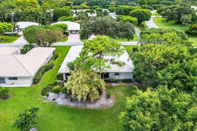 Welcome to your tranquil retreat featuring a captivating garden on Quail Ridge Golf Course and Country Club in Florida - for sale on GolfHomes.com, golf home, golf lot