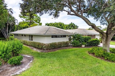 Welcome to your tranquil retreat featuring a captivating garden on Quail Ridge Golf Course and Country Club in Florida - for sale on GolfHomes.com, golf home, golf lot