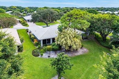 Welcome to your tranquil retreat featuring a captivating garden on Quail Ridge Golf Course and Country Club in Florida - for sale on GolfHomes.com, golf home, golf lot