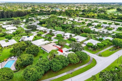 Welcome to your tranquil retreat featuring a captivating garden on Quail Ridge Golf Course and Country Club in Florida - for sale on GolfHomes.com, golf home, golf lot