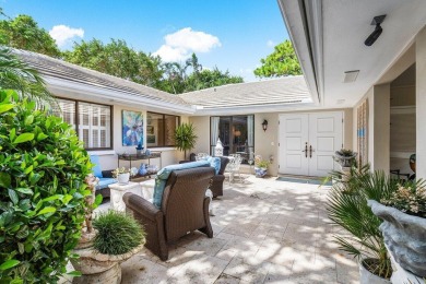 Welcome to your tranquil retreat featuring a captivating garden on Quail Ridge Golf Course and Country Club in Florida - for sale on GolfHomes.com, golf home, golf lot