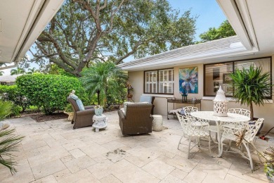 Welcome to your tranquil retreat featuring a captivating garden on Quail Ridge Golf Course and Country Club in Florida - for sale on GolfHomes.com, golf home, golf lot