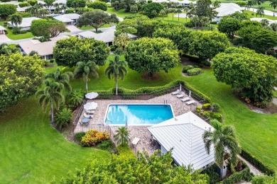 Welcome to your tranquil retreat featuring a captivating garden on Quail Ridge Golf Course and Country Club in Florida - for sale on GolfHomes.com, golf home, golf lot