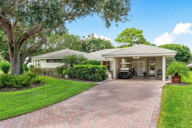 Welcome to your tranquil retreat featuring a captivating garden on Quail Ridge Golf Course and Country Club in Florida - for sale on GolfHomes.com, golf home, golf lot